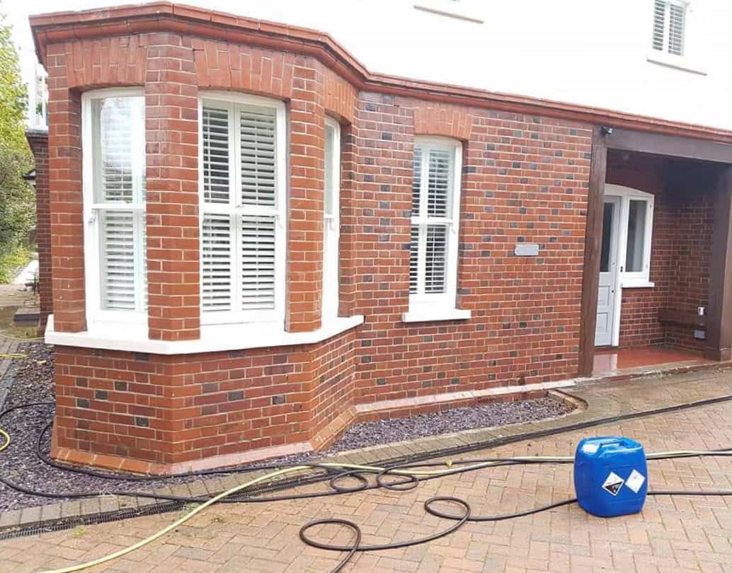 Clean red brickwork on a bay-fronted house in Hertfordshire after professional brick cleaning