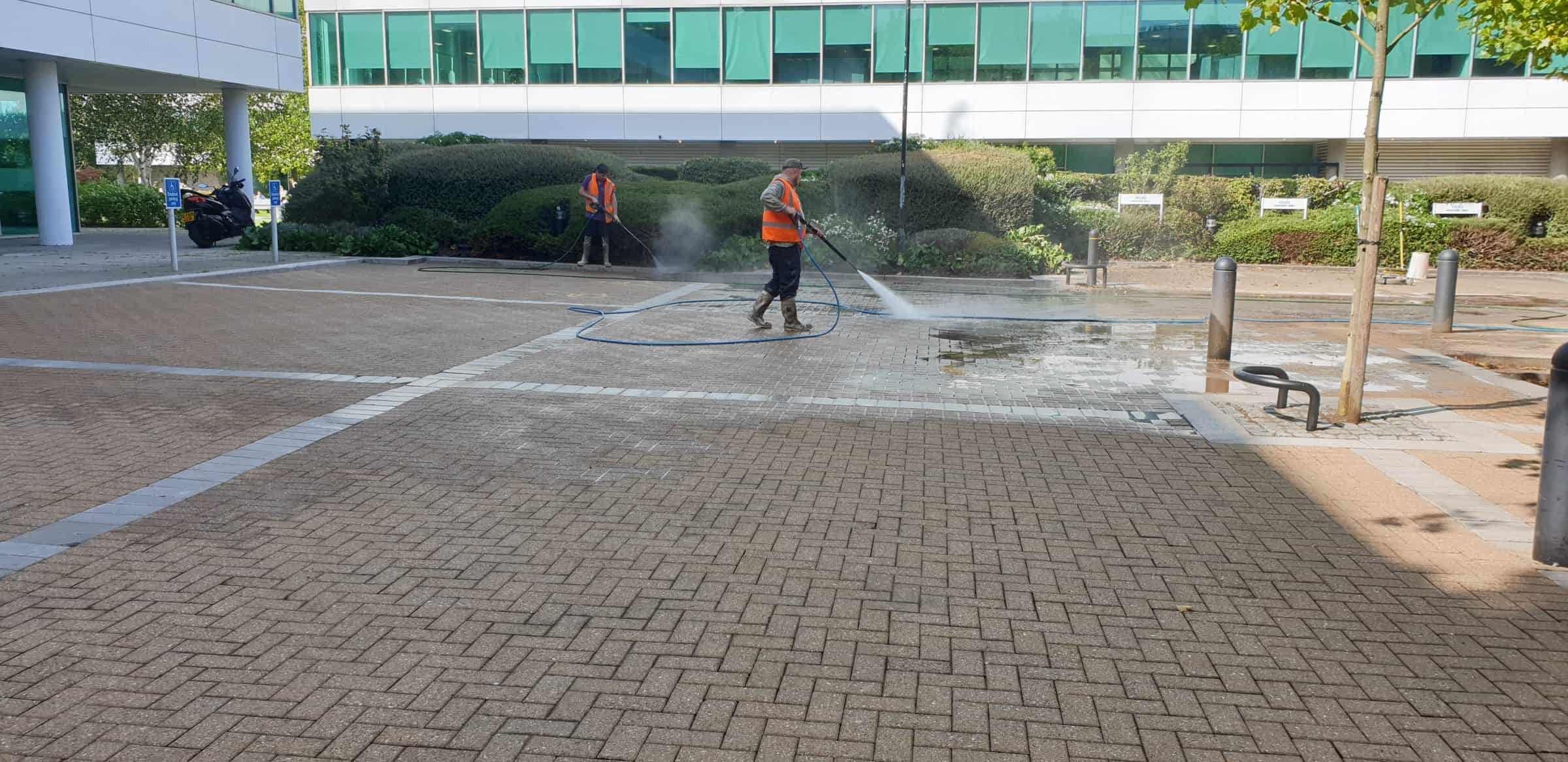 Rotary surface cleaner working across a large commercial car park