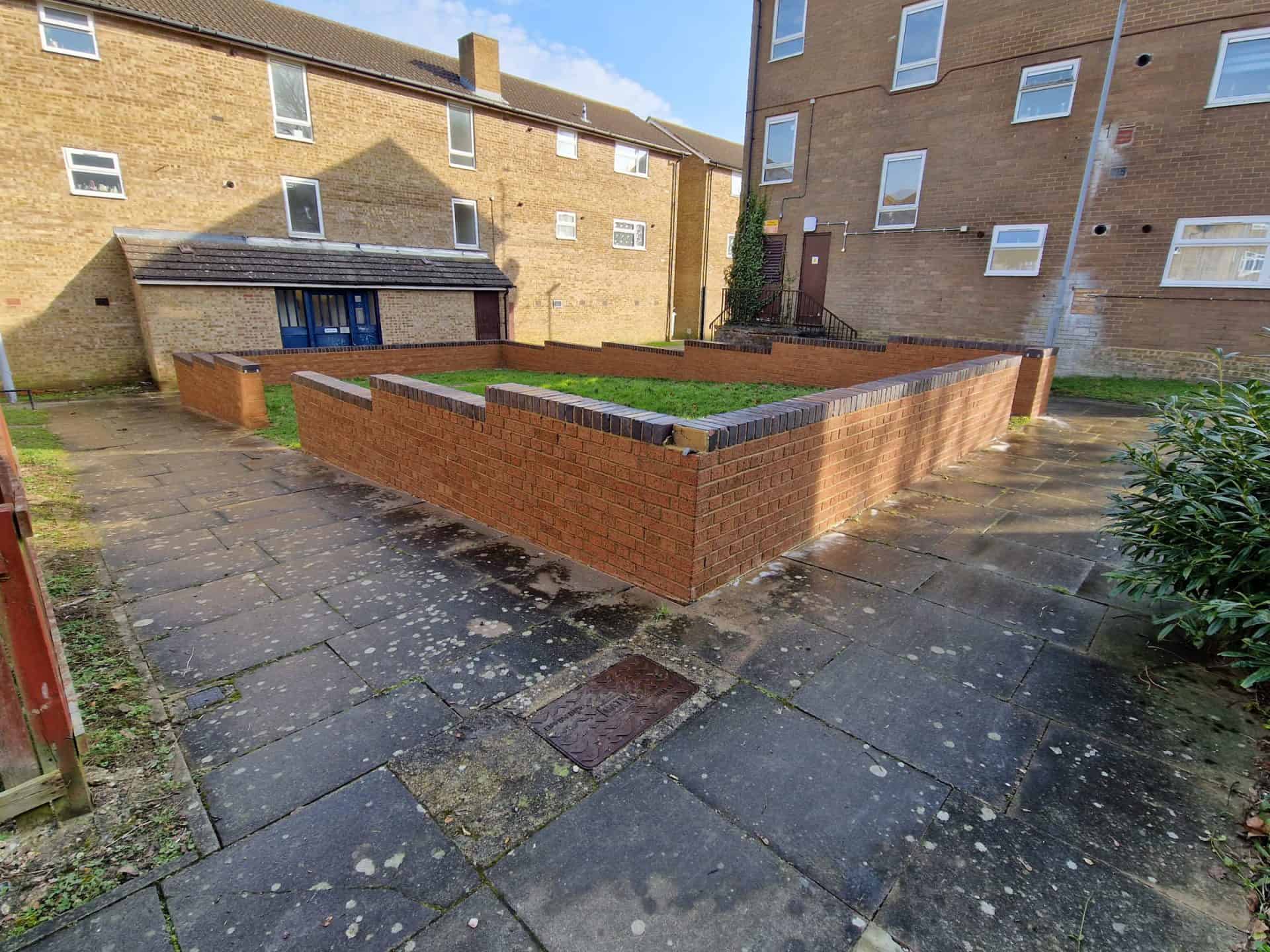 Paving being cleaned on a housing estate in Luton