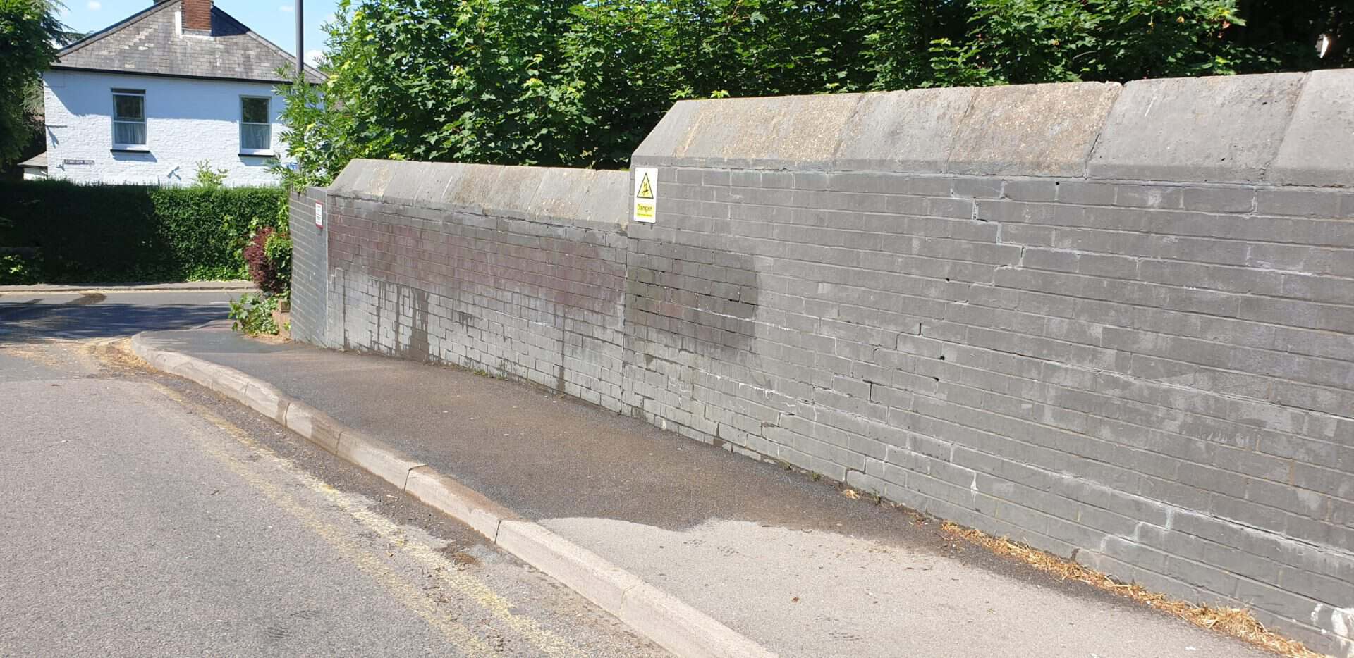 Brick wall in Harpenden after paint removal, cleaned back to bare brick