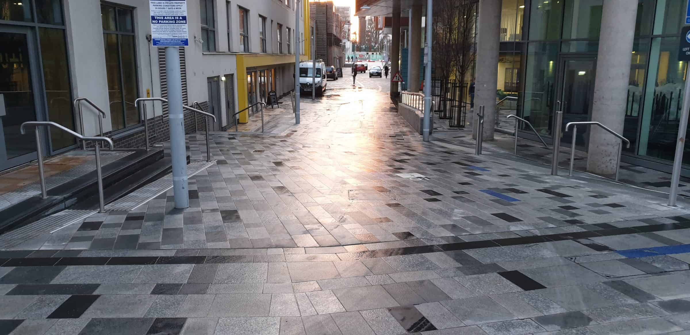Town centre paving being pressure washed in Barnet