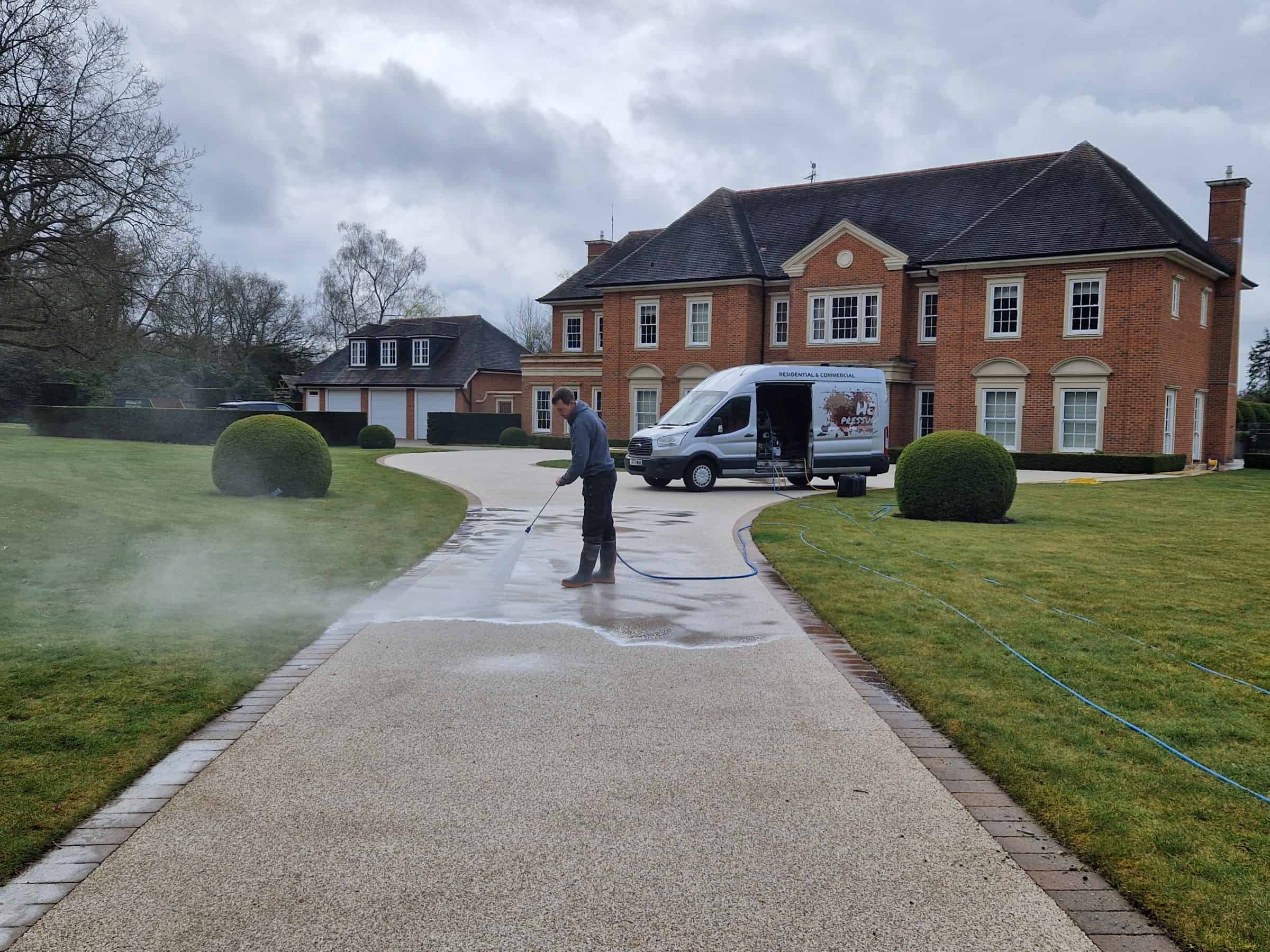 Freshly cleaned resin-bound driveway in front of a detached house in Hertfordshire