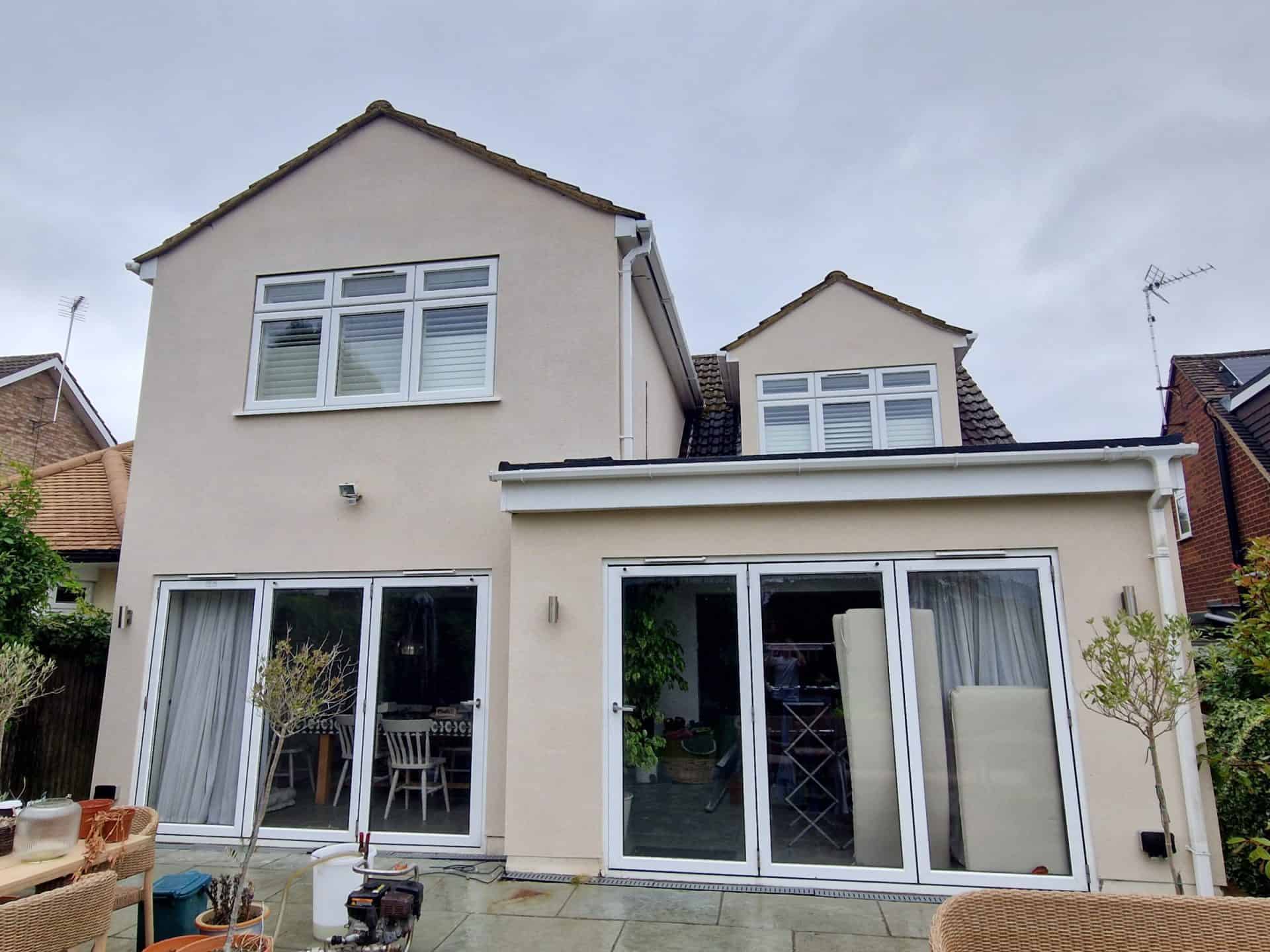Rendered gable end after low-pressure biocidal cleaning, algae and black mould gone