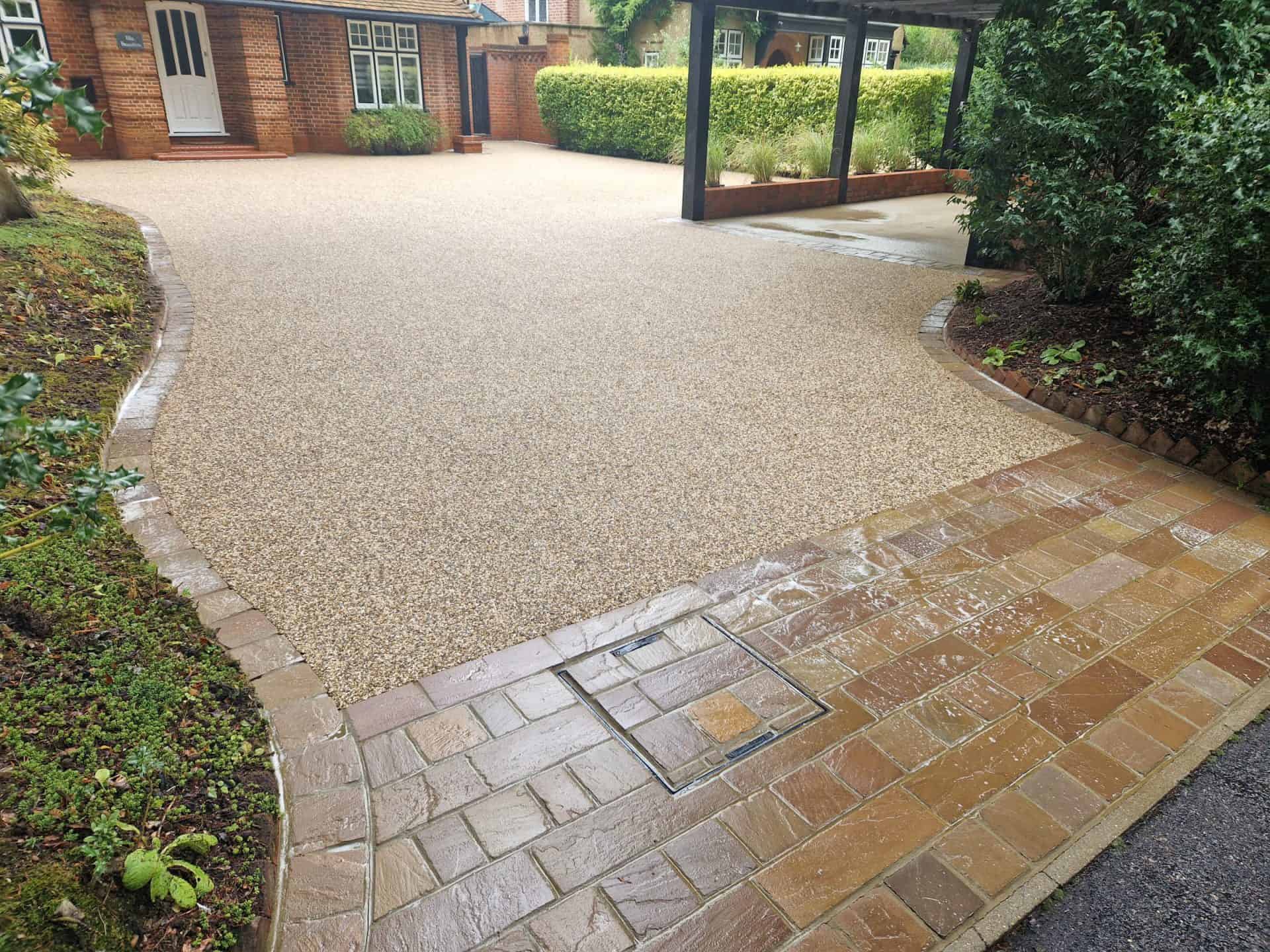 The same resin-bound driveway after cleaning, the aggregate colour restored with no striping or stone loss