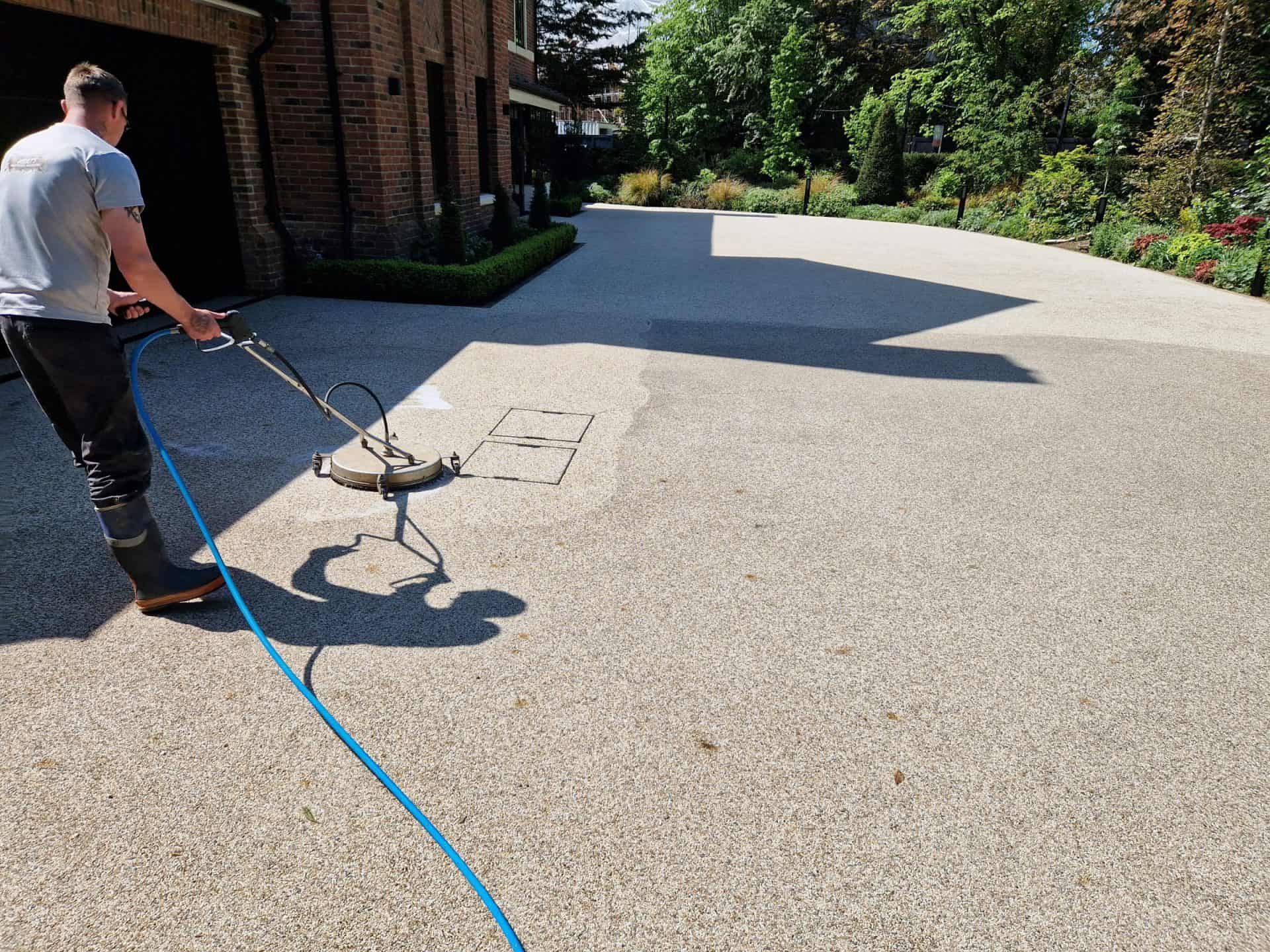 Mosmatic surface cleaner part way through cleaning a resin-bound driveway